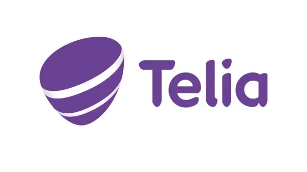 Logo for telia, med et stilisert lilla globusikon ved siden av firmanavnet i lilla tekst.